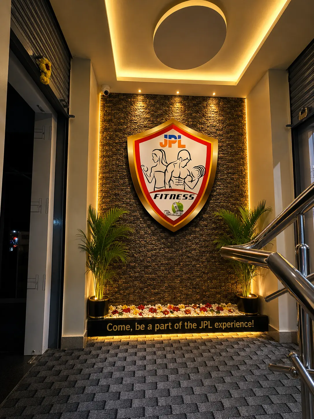 JPL Fitness entrance logo wall and welcome sign