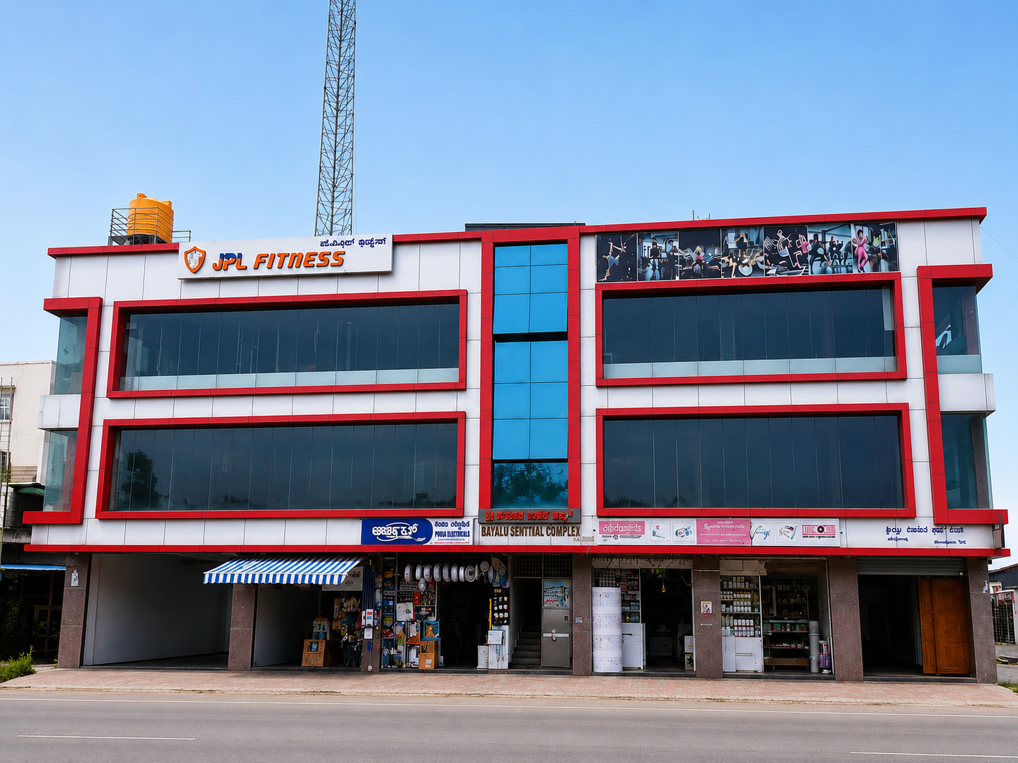 JPL Fitness building exterior with rooftop signage in Anjanapura, Bangalore